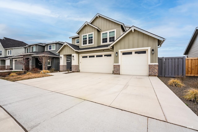 craftsman-style home featuring brick siding, board and batten siding, concrete driveway, and fence