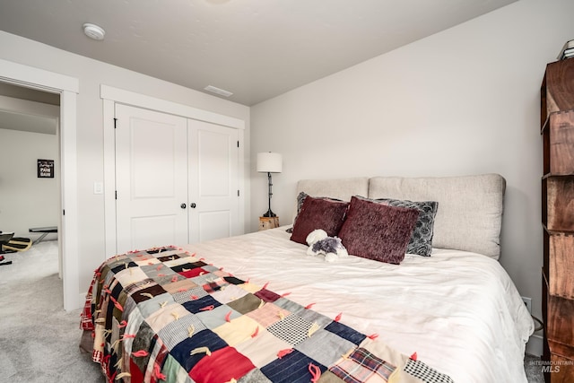 bedroom with a closet and carpet flooring