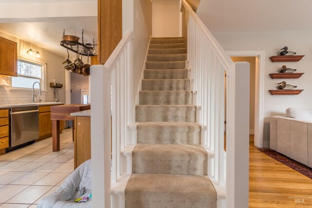 stairway featuring tile patterned floors
