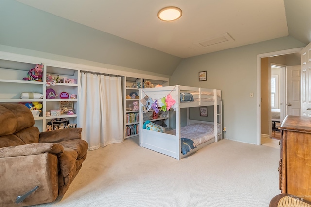 carpeted bedroom with lofted ceiling