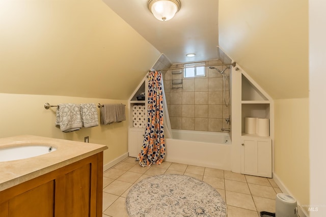 bathroom with tile patterned floors, baseboards, shower / bath combo, and vaulted ceiling