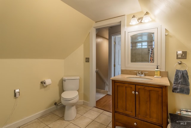 full bathroom with tile patterned flooring, toilet, vanity, and baseboards