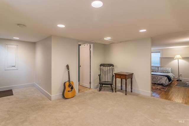 living area with carpet flooring, recessed lighting, and baseboards