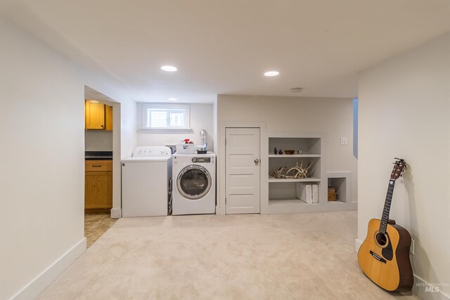 washroom featuring baseboards, light carpet, laundry area, recessed lighting, and washer and dryer