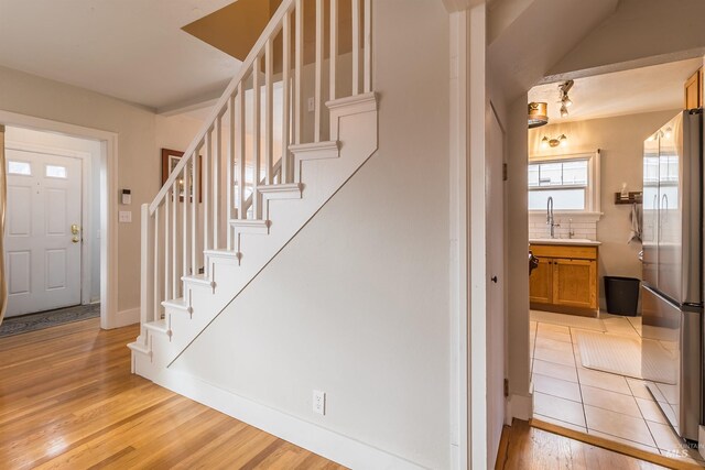 stairs with wood finished floors