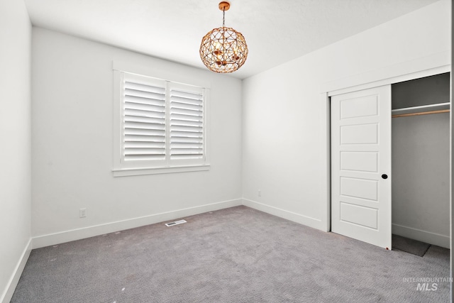 unfurnished bedroom featuring a closet and carpet