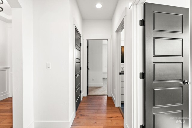 corridor featuring wood-type flooring