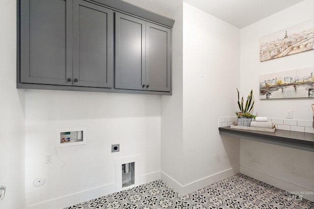 clothes washing area featuring hookup for a washing machine, cabinets, and hookup for an electric dryer