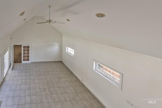 bonus room featuring baseboards, ceiling fan, and high vaulted ceiling