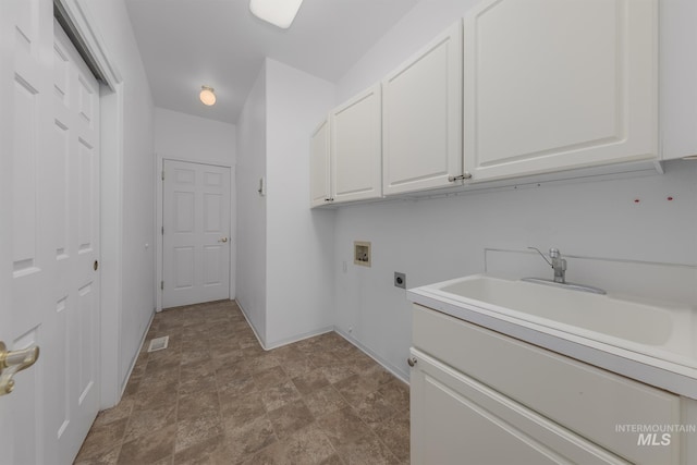 clothes washing area featuring baseboards, a sink, washer hookup, cabinet space, and electric dryer hookup