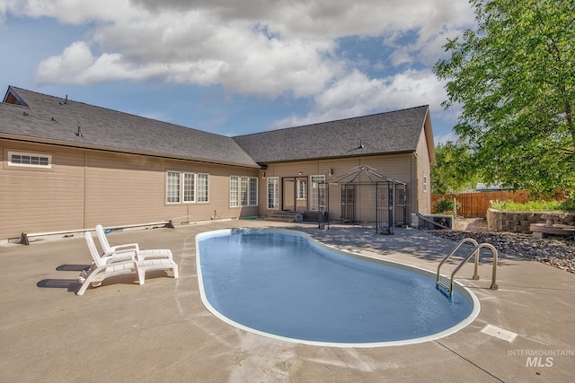 view of pool featuring fence, a patio, and a fenced in pool