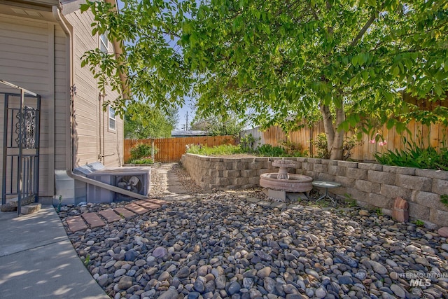 view of yard with a fenced backyard