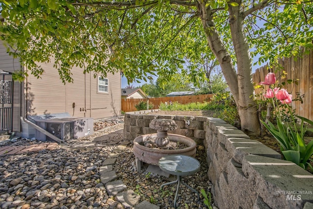 view of yard featuring cooling unit and a fenced backyard