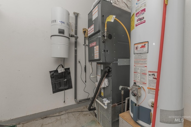 utility room featuring heating unit and water heater