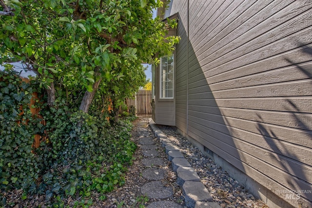 view of home's exterior featuring fence