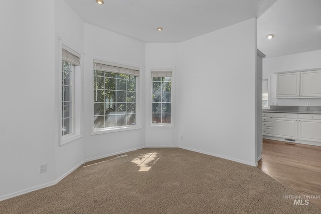 interior space with visible vents, baseboards, and recessed lighting