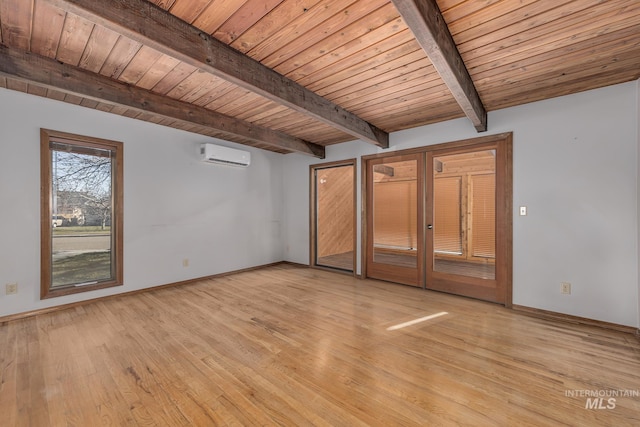 interior space featuring wooden ceiling, a wall unit AC, beam ceiling, and light wood-style flooring