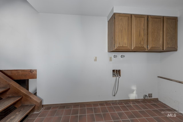 washroom with cabinet space and washer hookup