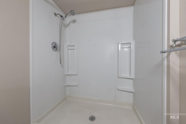 full bathroom featuring a stall shower