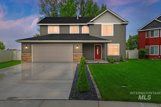 2513 S Vineyard St, Nampa, ID 83686 - traditional home with driveway, a garage, stone siding, and board and batten siding