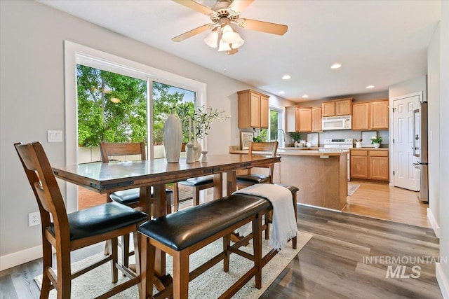 2513 S Vineyard St, Nampa, ID 83686 - dining space featuring light wood-style flooring, a ceiling fan, recessed lighting, and baseboards