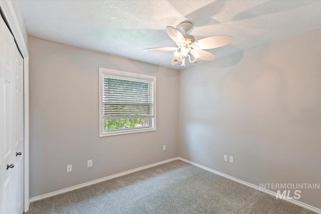 2513 S Vineyard St, Nampa, ID 83686 - spare room featuring carpet, a ceiling fan, baseboards, and a textured ceiling