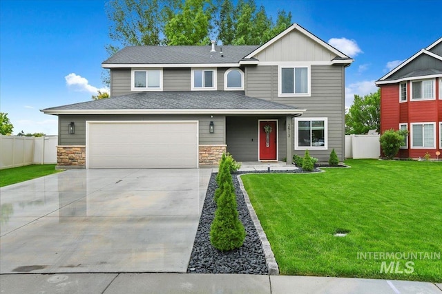 2513 S Vineyard St, Nampa, ID 83686 - view of front of home featuring a garage, concrete driveway, stone siding, and board and batten siding
