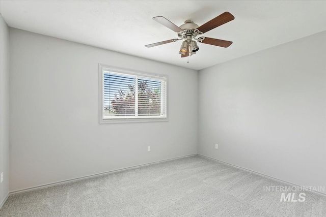 2513 S Vineyard St, Nampa, ID 83686 - unfurnished room with light carpet, baseboards, and a ceiling fan