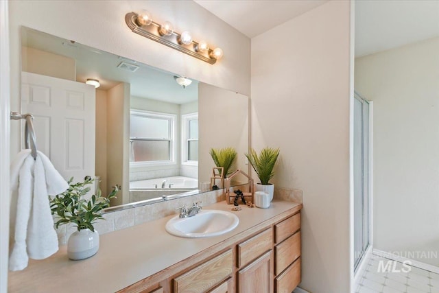 2513 S Vineyard St, Nampa, ID 83686 - full bathroom with a bath, vanity, and a stall shower