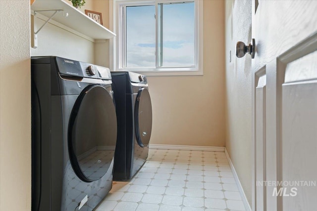 2513 S Vineyard St, Nampa, ID 83686 - washroom featuring washing machine and dryer, light floors, and baseboards