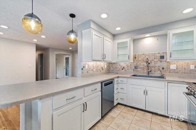 7301 W Diamond St, Boise, ID 83709 - kitchen featuring stainless steel appliances, a sink, a peninsula, light countertops, and recessed lighting