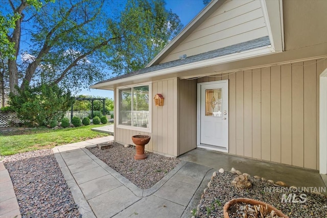 7301 W Diamond St, Boise, ID 83709 - entrance to property featuring a lawn and a shingled roof