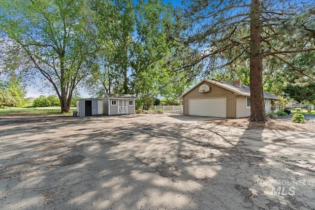 7301 W Diamond St, Boise, ID 83709 - view of home's exterior with a chimney and driveway