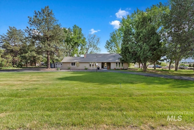7301 W Diamond St, Boise, ID 83709 - view of front of home with a front lawn and asphalt driveway