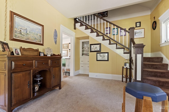 stairs featuring carpet