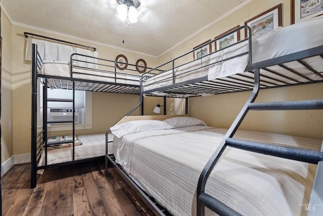 bedroom featuring ornamental molding, hardwood / wood-style floors, and cooling unit