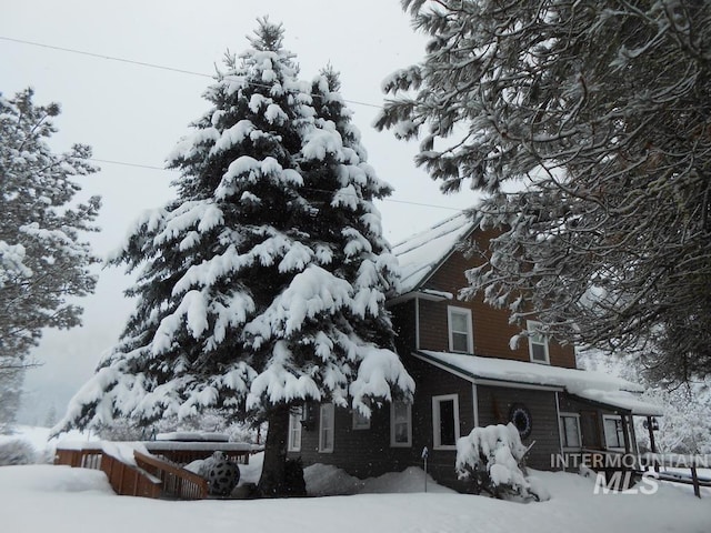 view of snow covered property