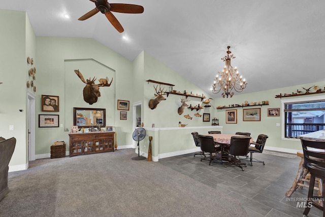 dining space with ceiling fan with notable chandelier, dark carpet, and lofted ceiling