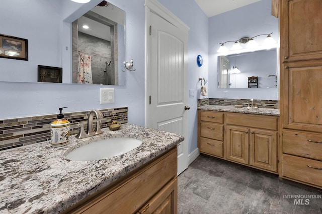 bathroom featuring vanity, tasteful backsplash, and curtained shower