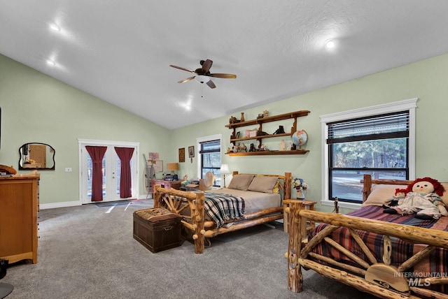 carpeted bedroom with access to outside, multiple windows, ceiling fan, and vaulted ceiling