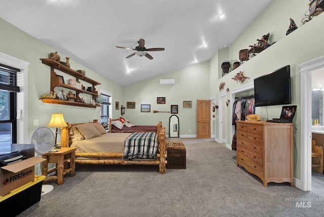 carpeted bedroom with ceiling fan, high vaulted ceiling, and a closet