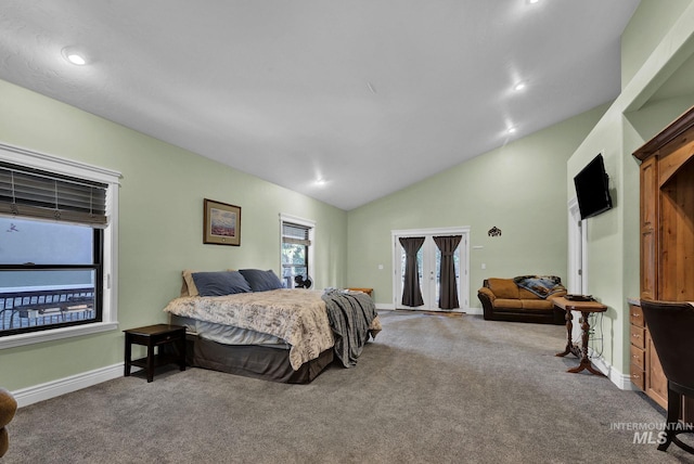 carpeted bedroom featuring lofted ceiling