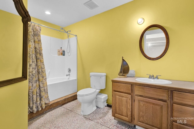 full bathroom with shower / bath combo, vanity, and toilet