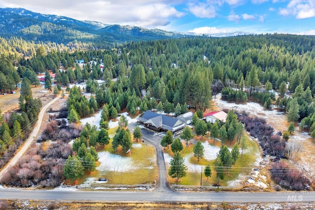 drone / aerial view featuring a water and mountain view