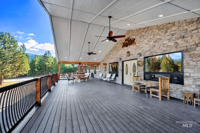 wooden terrace featuring ceiling fan