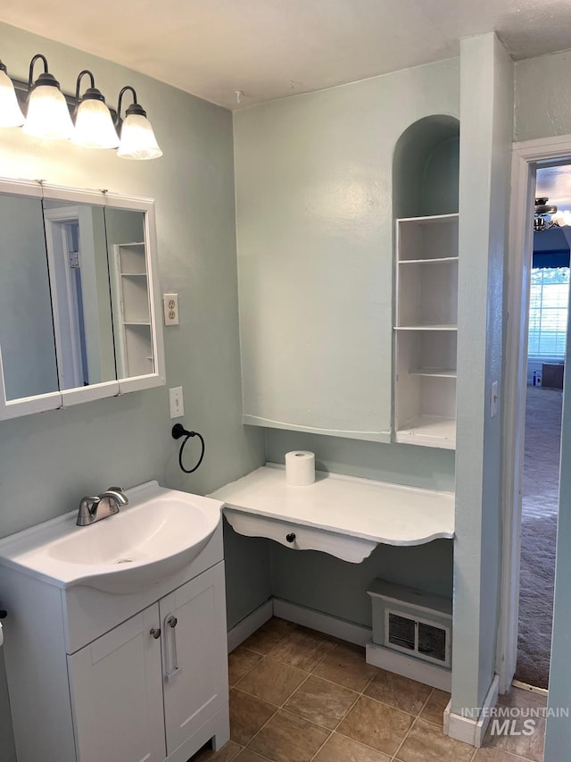 bathroom with visible vents and vanity