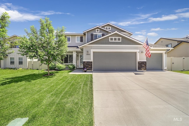 craftsman-style house with a garage and a front lawn