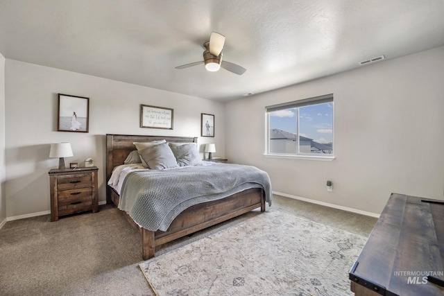 bedroom with ceiling fan and carpet floors