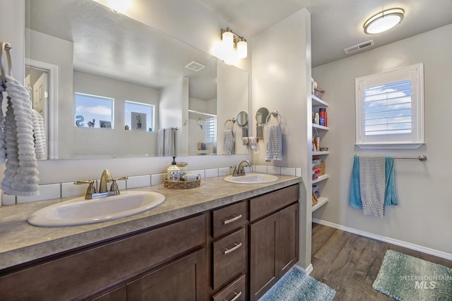 bathroom featuring hardwood / wood-style floors and vanity