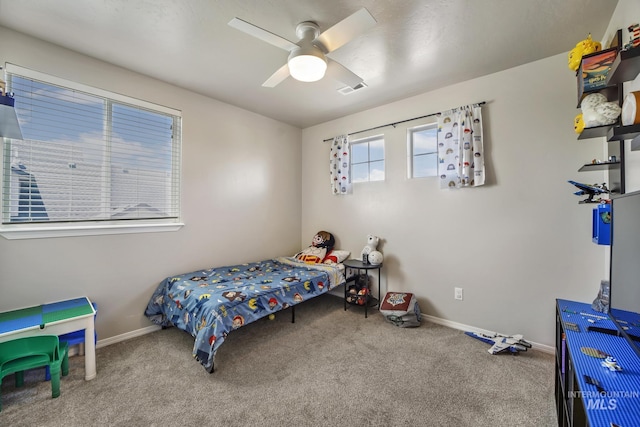 carpeted bedroom featuring ceiling fan